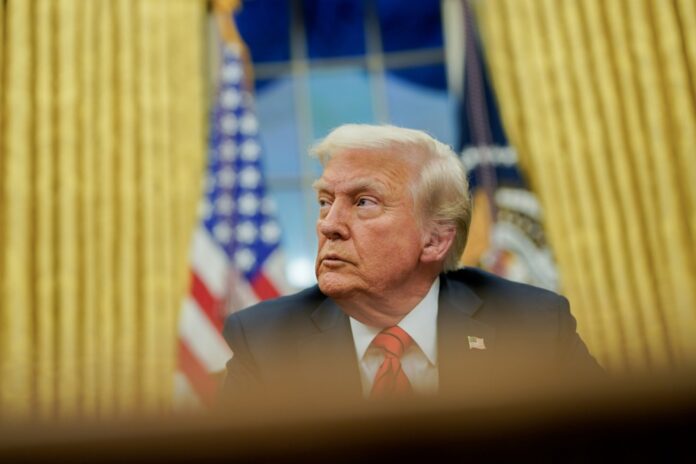 US President Trump signs executive order in Oval Office