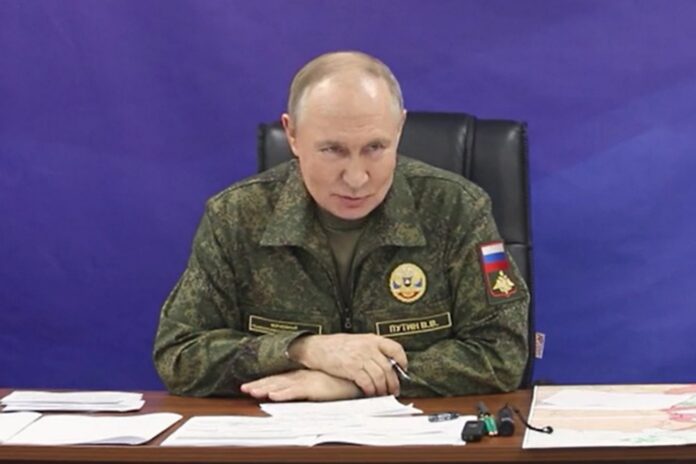 Russian President Vladimir Putin visits the command posts of the Joint Group of Forces