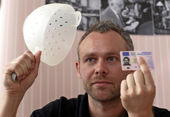 Austrian driver's religious pasta strainer headgear
