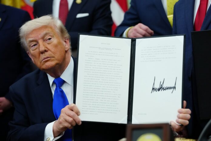 US President Donald Trump signs executive orders at White House