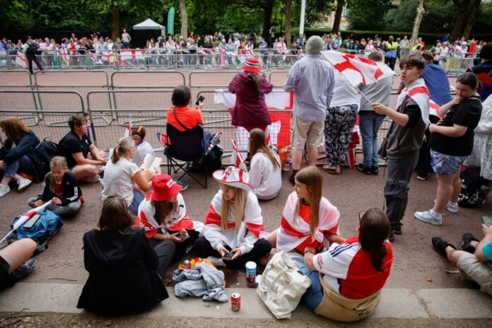 England Women's team celebrate winning with open-top bus parade