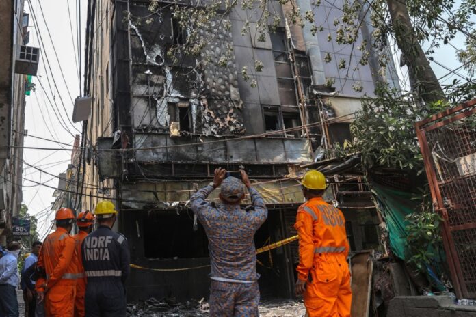 Over 20 people killed as fire rips through South Delhi hotel