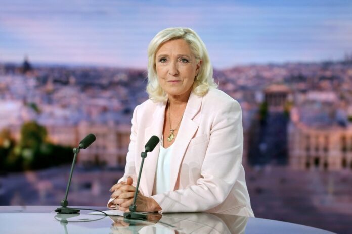 French far-right leader Le Pen reacts on TV after her appeal trial verdict